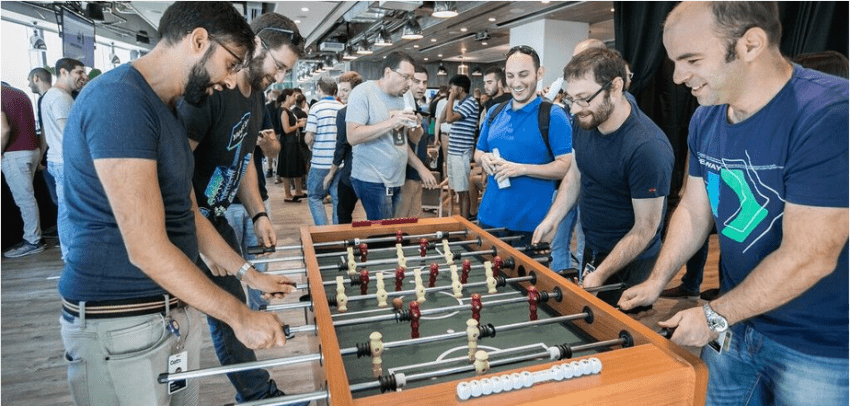 men playing foosball at Oath brand launch