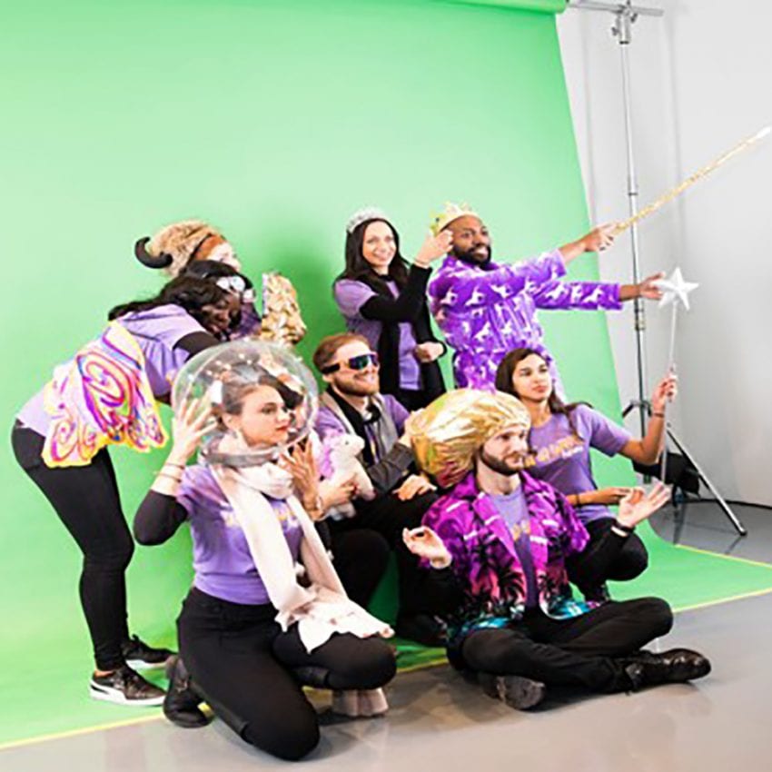 team wearing purple on green screen for Yahoo