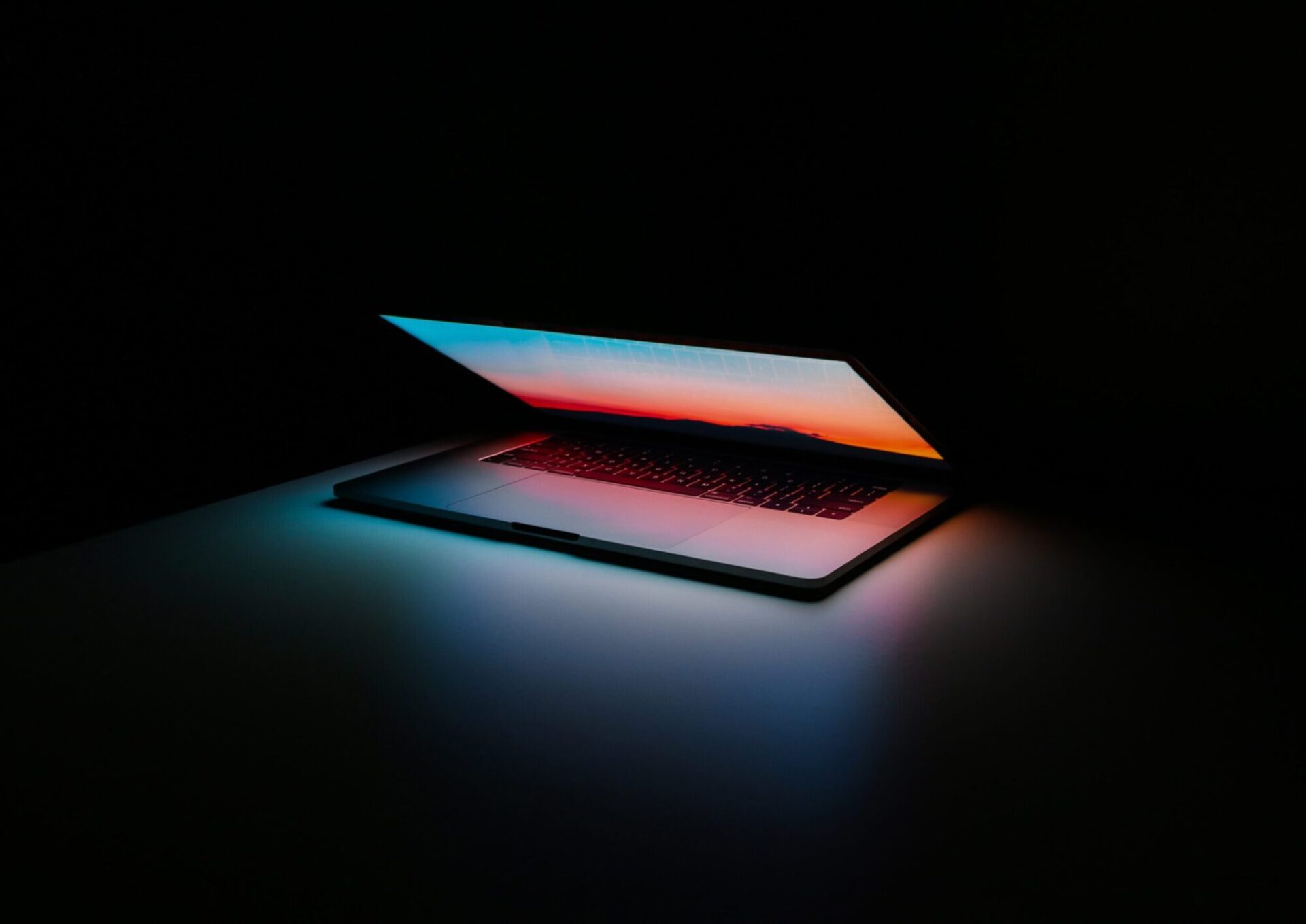 lit macbook laptop display