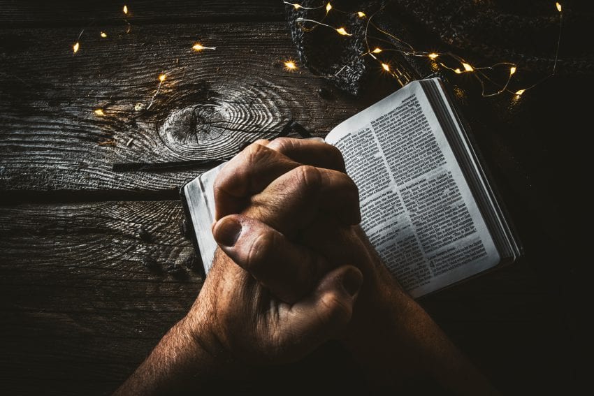 storytelling with hands over book