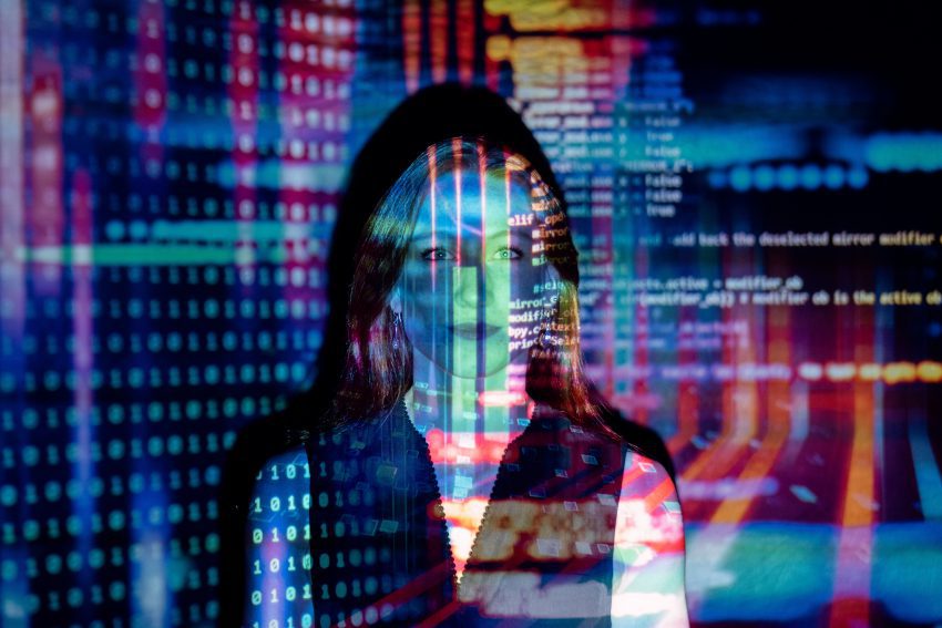 woman standing in front of data projection